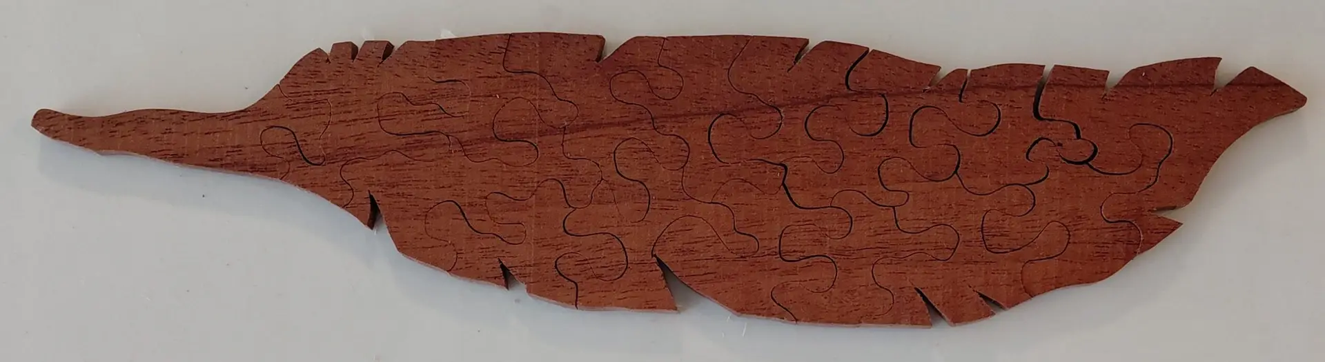 hand crafted wooden jigsaw puzzle feather